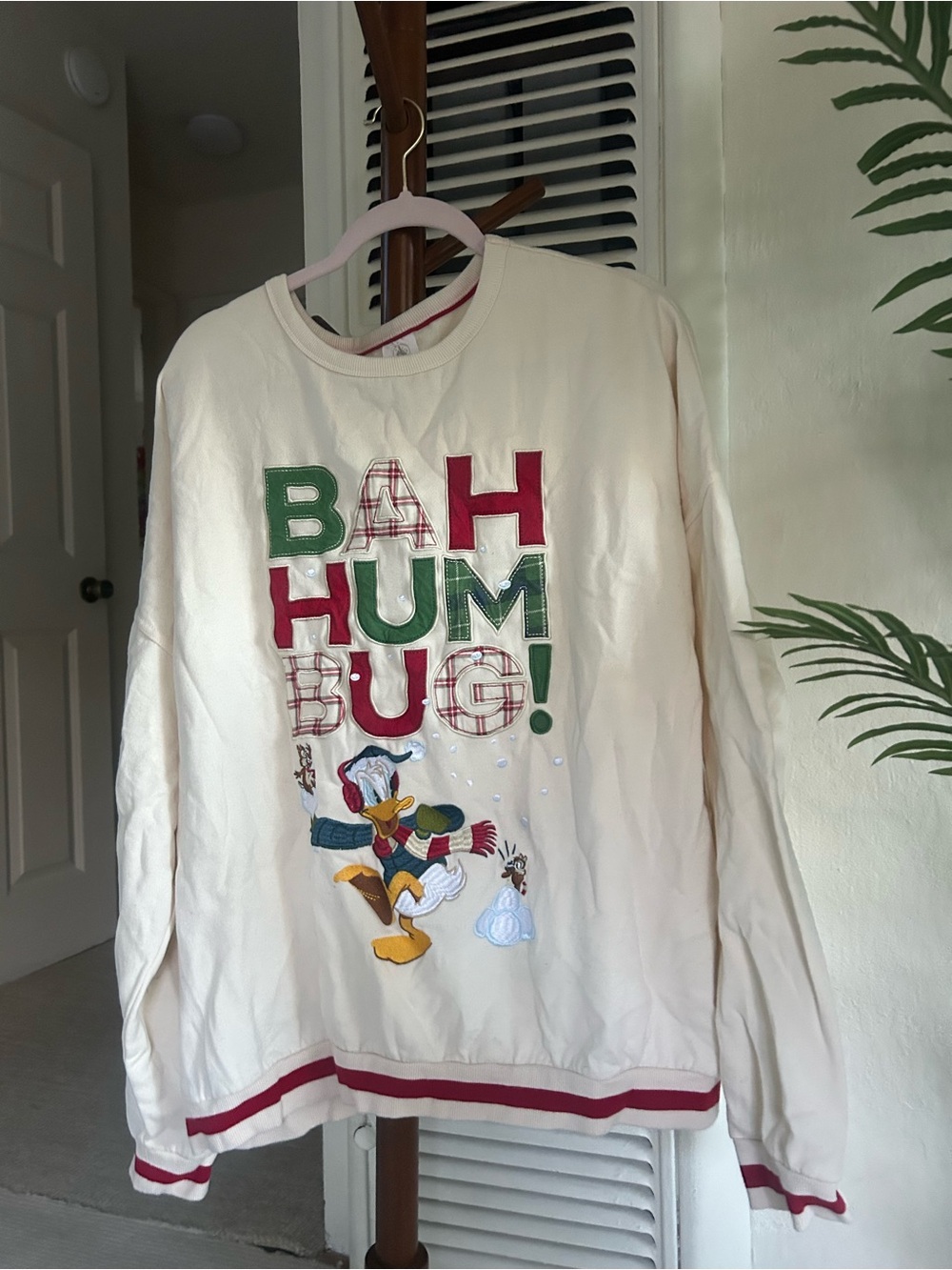 Disney Cream Sweatshirt with Red and Green Holiday Graphic